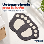 Tapete gris de baño con huellas crema — portada Vendalia