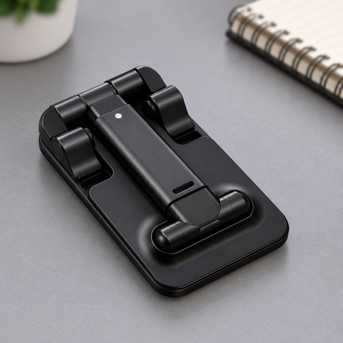 Soporte plegable negro cerrado para guardarlo.