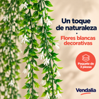 Planta artificial colgante de cinco tallos verdes con pequeñas hojas verdes y flores blancas alargadas de pétalos estrechos. — portada Vendalia