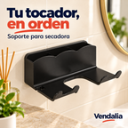 Soporte de pared negro para secadora con tres compartimentos traseros de borde ondulado y dos plataformas delanteras separadas por abertura en U, dos horquillas de borde elevado — portada Vendalia