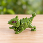 Dinosaurio armable naranja · ejemplo de modelo surtido · SKU 54071