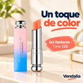 Labial Sol Radiante tono 120 naranja cálido con su tapa degradada rosa y azul.