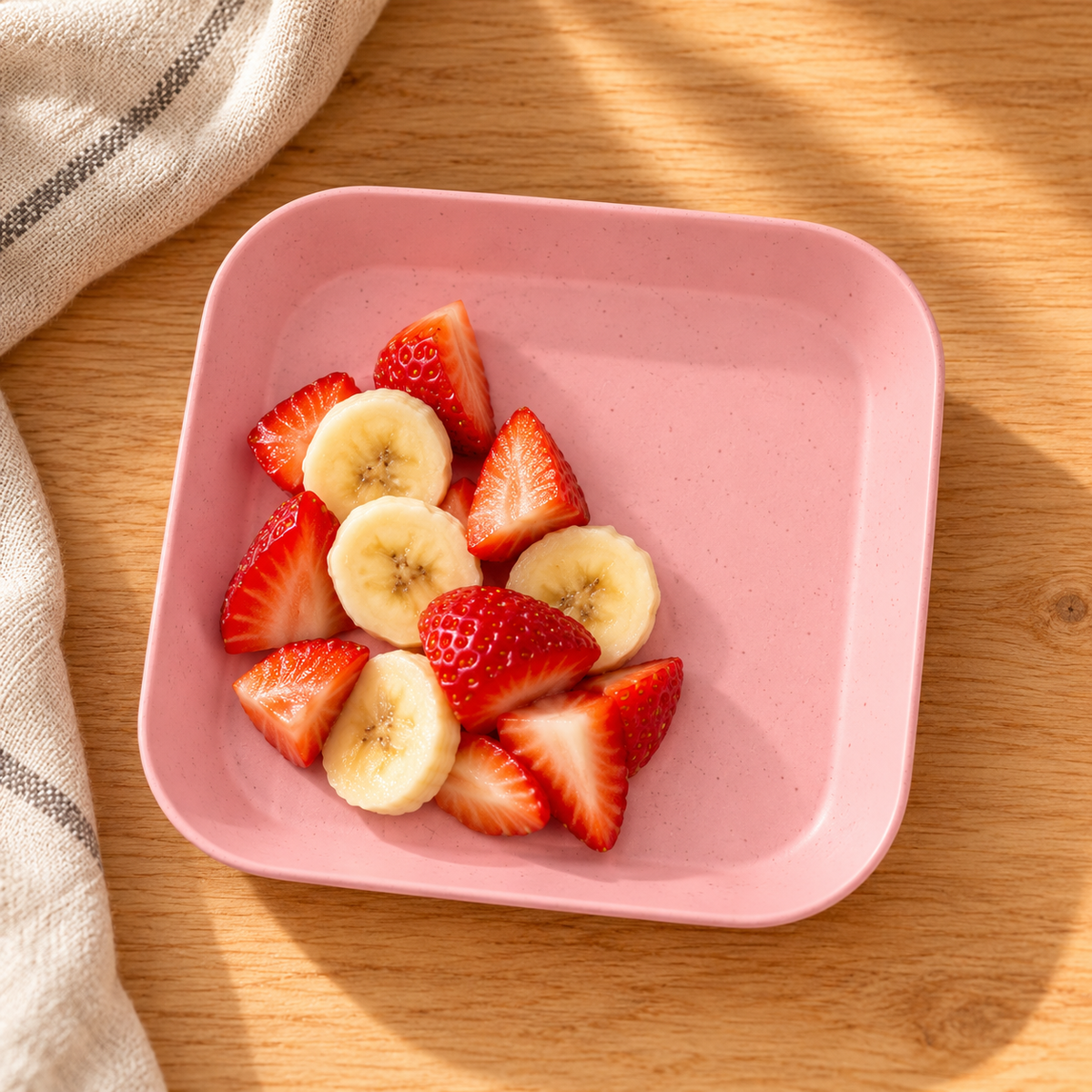 Plato cuadrado rosa · vista superior con fruta no incluida