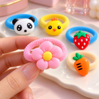 Set de ligas para cabello con figuras — Vista de detalle. Selección ilustrativa · Diseños surtidos