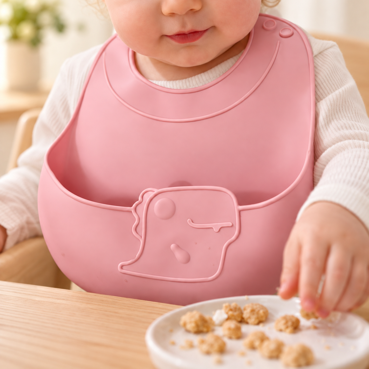Babero de silicona con bolsillo · dinosaurio — Rosa — SKU 52814