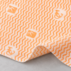 Detalle de la textura y estampado naranja de un paño.