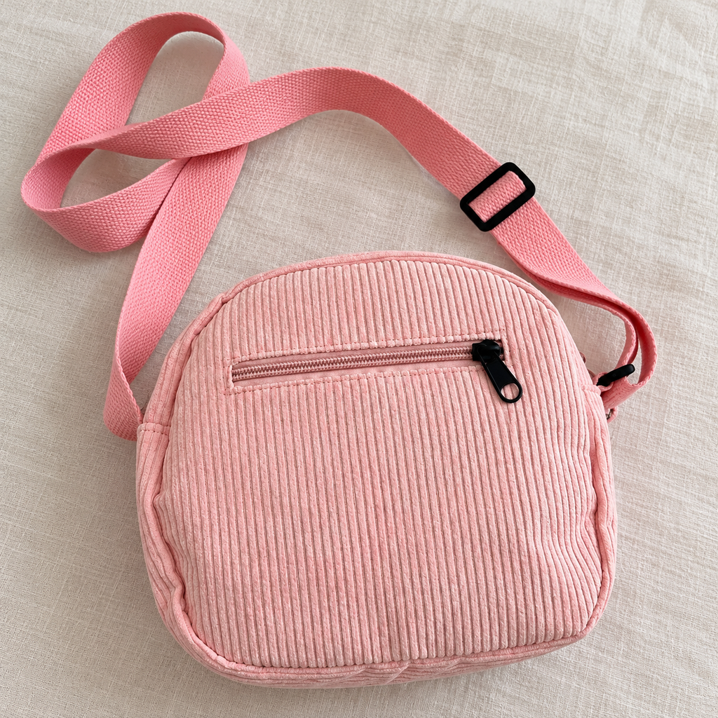 Bandolera rosa — bolsillo trasero