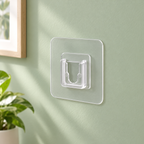 Gancho adhesivo invisible de pared · Paquete de 6 piezas en ambiente de hogar — Vendalia. La fotografía muestra una pieza de ejemplo del paquete de 6.