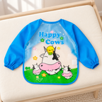 Babero Impermeable Infantil con Mangas vacas en ambiente Vendalia