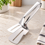Pinza Espátula 2 en 1 de Acero Inoxidable en ambiente de hogar — Vendalia